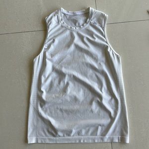 White sleeveless tank. Metal vent